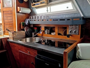 Fridge, stovetop, coffee/tea maker, cookware/dishes/utensils