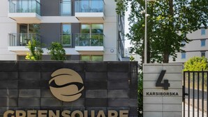 A building with a sign reading 'Greensquare' and 'Karsiborska 4'.