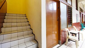 A staircase leading to an elevator with a door marked '209'. - Hotel O Mutiara (Magelang)