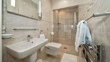 Luxury Penthouse | Bathroom | Designer toiletries, hair dryer, bathrobes, slippers