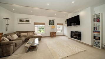 Luxury Penthouse | Living area | 55-inch Smart TV with satellite channels