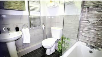 Separate tub and shower, deep soaking tub, hair dryer, towels