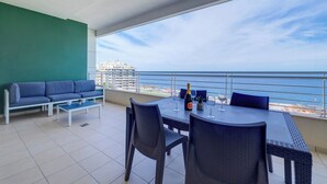 A balcony with a dining table, chairs, and a sofa. - Oceanview Luxury, Fort Cambridge w/POOL (Sliema)