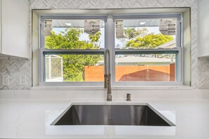 Enjoy a view of the surrounding neighborhood from the kitchen window.