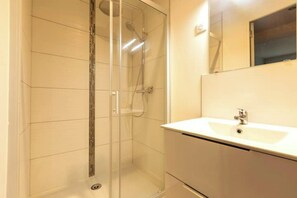 Shower, towels, soap, toilet paper