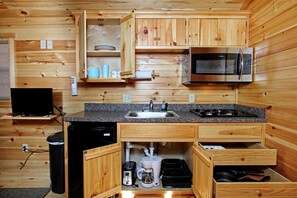 Microwave, stovetop, coffee/tea maker, cookware/dishes/utensils