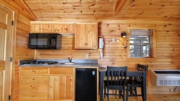 Fridge, microwave, coffee/tea maker, cookware/dishes/utensils