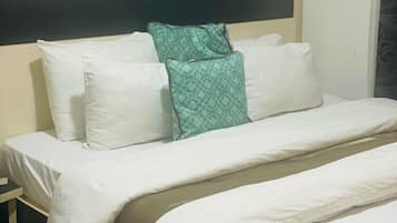 Suite Deluxe | 1 habitación y ropa de cama
