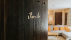 A dark wooden door with the name "Pinarella" in cursive writing. - Newton Hall Courtyard Rooms (Alnwick)