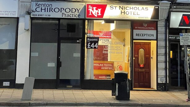 A building with a sign for 'Kenton Chiropractic Practice' and 'St Nicholas Hotel'. - St Nicholas Hotel Kenton (Harrow)