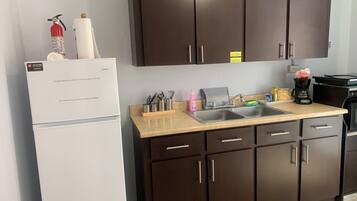 Fridge, microwave, stovetop, coffee/tea maker