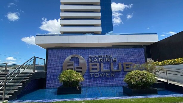 A modern building with a prominent blue and white color scheme, featuring a sign that reads "Kariris Blue Tower." - Kariris Blue Tower (Crato)