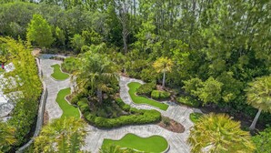 An aerial view of a landscaped garden with winding pathways and various types of vegetation. - Mickey's Manor: Private Pool & Resort Access (Davenport)
