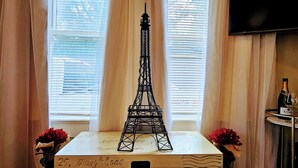 A model of the Eiffel Tower on a wooden box with handwritten address in London, England. - Royal European Corner to a Romantic Gateaway by Downtown-Houston, Heights & WOMH (Houston)