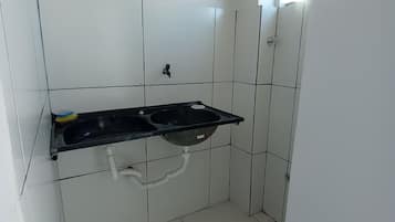 Executive Apartment | Private kitchen | Fridge, cookware/dishes/utensils, cleaning supplies, dining tables