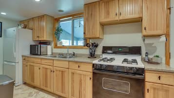 Fridge, microwave, stovetop, coffee/tea maker