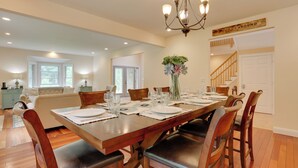 A dining room with a wooden table set for six, surrounded by wooden chairs. - Glen Spey Home w/ Grill ~ 5 Mi to Delaware River (Glen Spey)