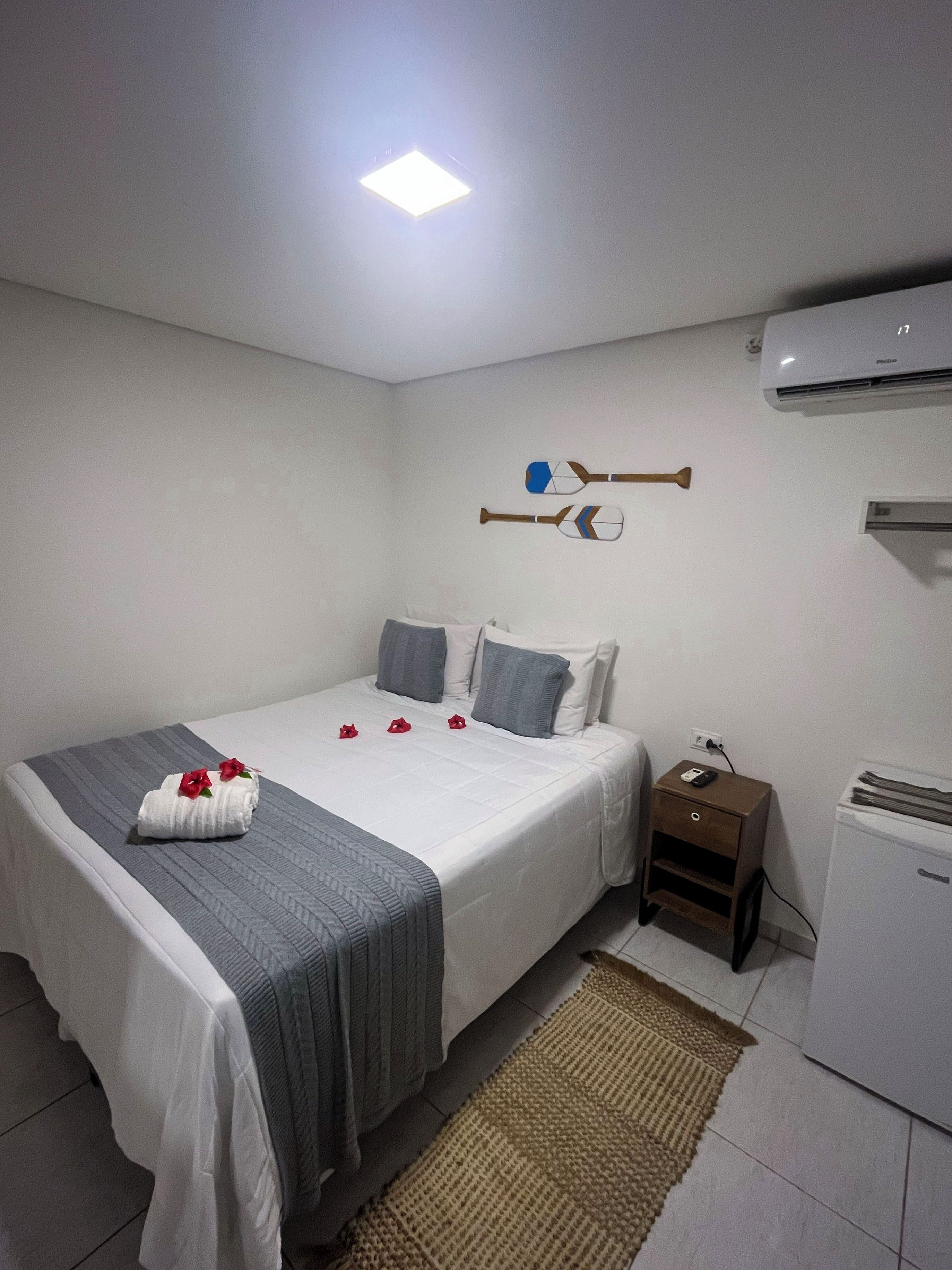 Economy Room, 1 Bedroom | Minibar, bed sheets
