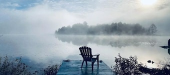 Northern Retreat, 3BR Rustic Cabin: Lakeview, Private Beach & Dock, Pet Friendly