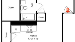 A floor plan of a house with a bedroom, living room, bathroom, kitchen, and a balcony. - Beach Daze by Ryson Vacation Rentals (Galveston)