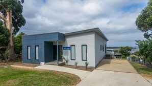 A modern building with a sign reading "Bella Vets." - Bella Views Pet friendly with expansive views. (Mallacoota)
