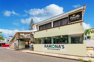 A two-story building with a sign for Ramona's Restaurant and a Vanilla Cocktail Bar.