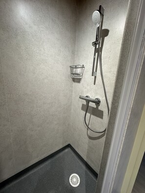 Shower, eco-friendly toiletries, hair dryer, towels