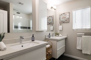 Combined shower/tub, hair dryer, towels, soap
