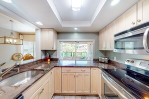 Fridge, microwave, oven, stovetop - Inviting condo with water view, covered balcony, on-site pool (Hilton Head)