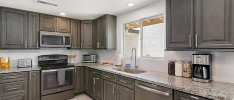 Microwave, toaster, blender, cookware/dishes/utensils