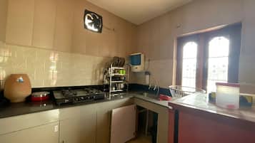 Fridge, stovetop, toaster, cookware/dishes/utensils