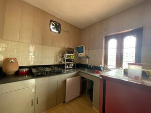 Fridge, stovetop, toaster, cookware/dishes/utensils