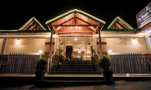 Welcome to our charming hotel, where a beautifully designed entrance sets the tone for a memorable stay.