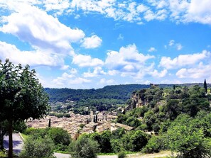 A historic town with ancient ruins and dense greenery.