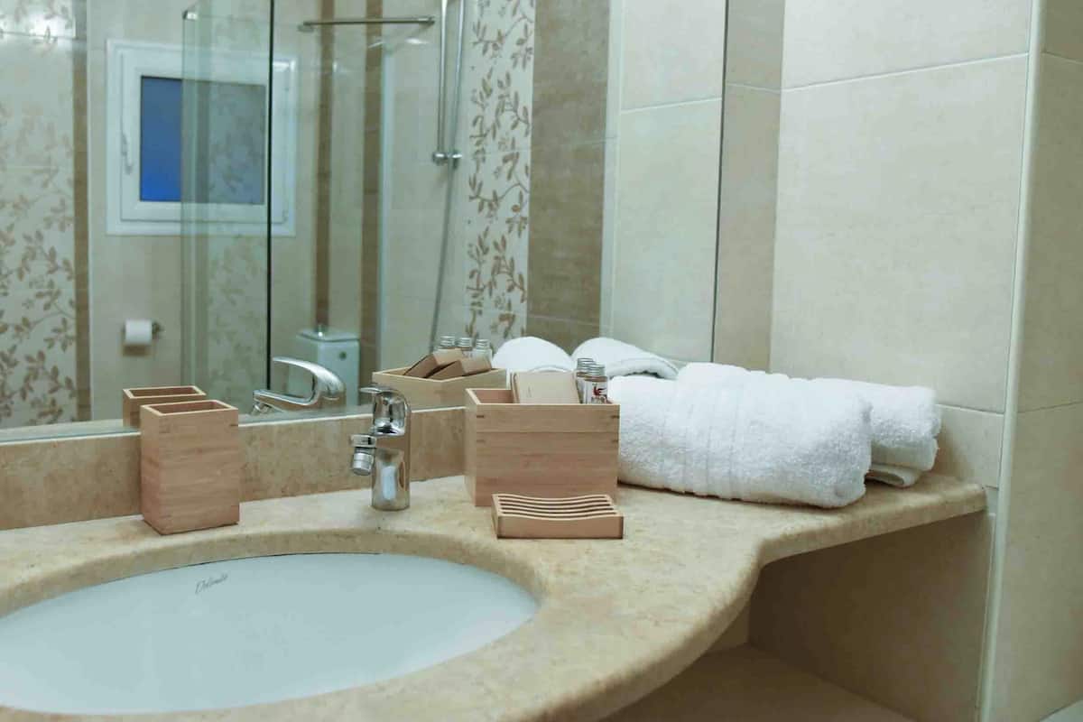 Luxury Apartment, Courtyard View | Bathroom | Free toiletries, hair dryer, bathrobes, slippers
