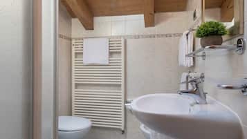 Bathtub, hair dryer, towels