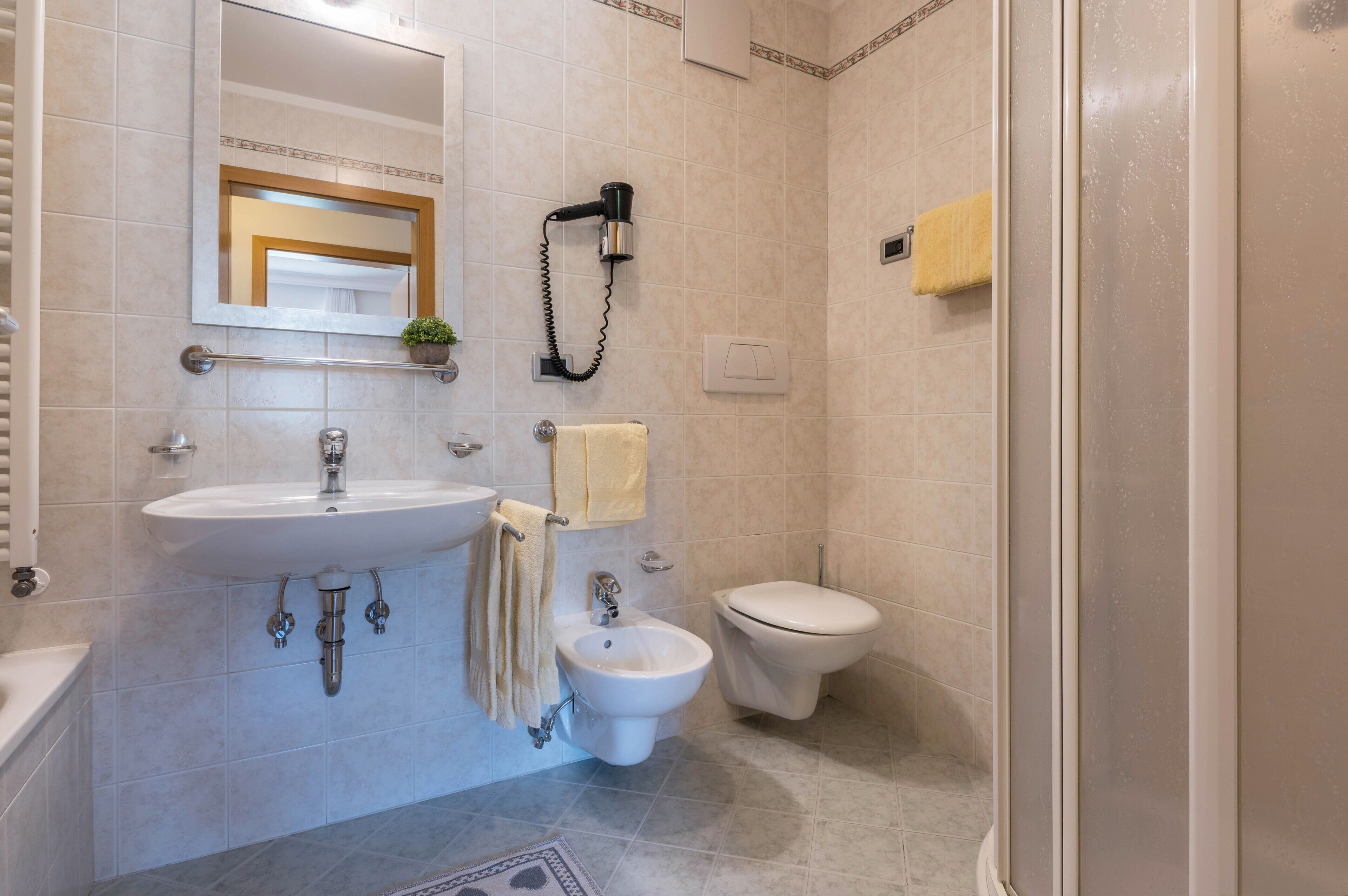 Bathtub, hair dryer, towels