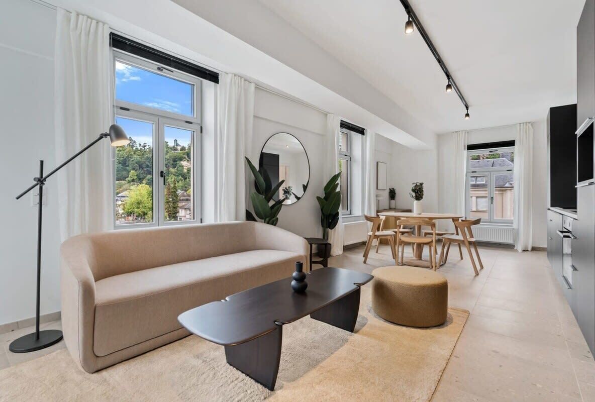 Spacious elegance: Delight in the expansive living and dining area, flooded with natural light, perfect for gatherings. Direct bookings: www.arcaproperties.lu