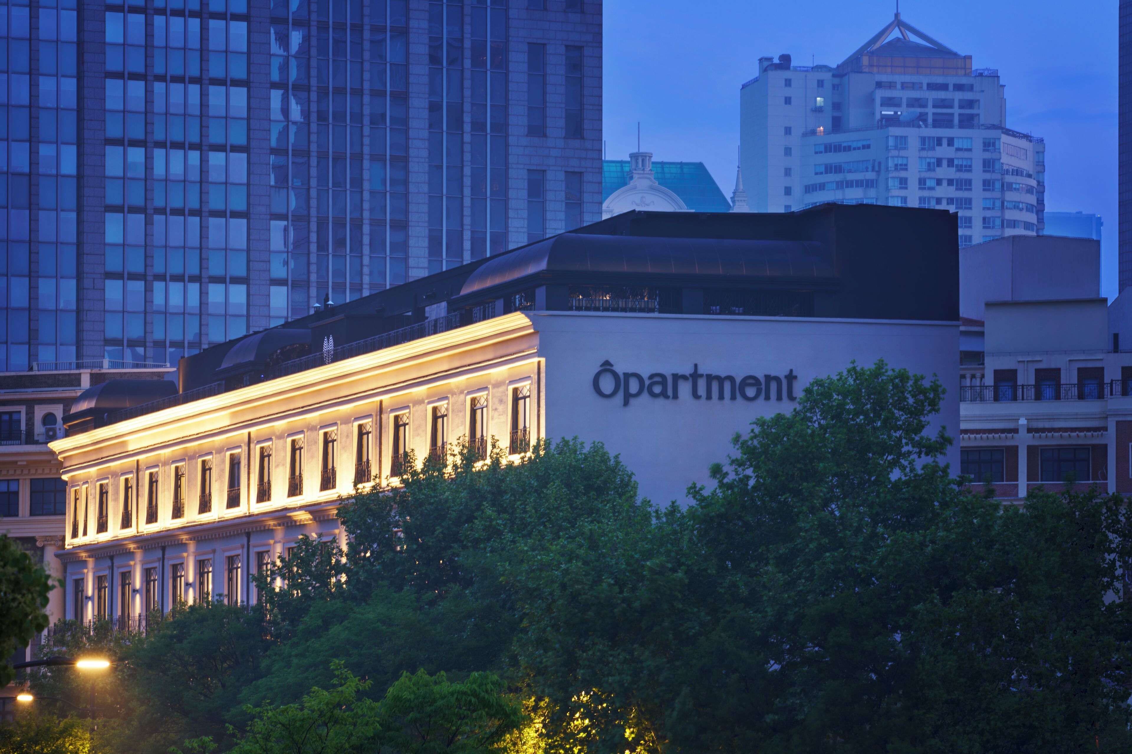 A building with a sign that reads "Apartment."