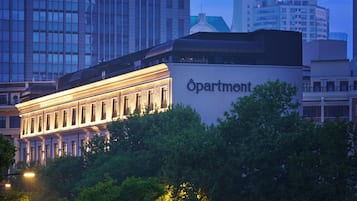 A building with a sign that reads "Apartment."