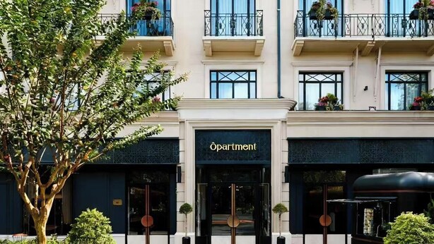 A multi-story hotel with a classic facade, multiple balconies with flower boxes, and a prominent entrance with a sign reading "Apartment". - OPARTMENT The Far Eastern Hotel - People's Square (Shanghai)