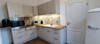 Modern apartment with fireplace, e-charging station and free parking space