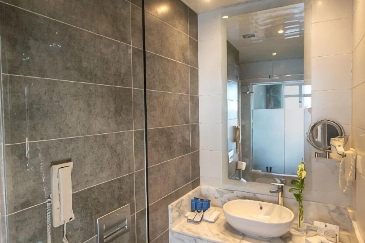 Bathroom | Hair dryer, slippers, towels