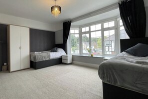 4 bedrooms, premium bedding, iron/ironing board, free WiFi