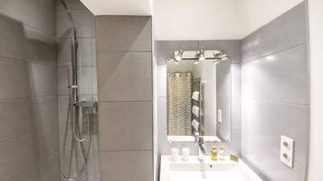 Shower, eco-friendly toiletries, hair dryer, towels