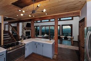 Microwave, dishwasher, coffee/tea maker, dining tables
