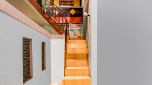 A staircase with a sign for Hotel Parangtritis, featuring a family-friendly and travel accommodation facility.