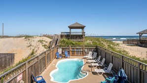 A beachside pool area with a wooden deck, lounge chairs, and a gazebo overlooking the ocean. - Sandy Too-Oceanfront, pool, hot tub, private walkway with gazebo,amazing ocean views! (Nags Head)