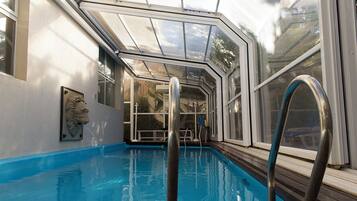 Indoor pool, open 8:00 AM to 10:00 PM, pool loungers