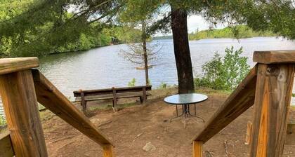 Cozy cabin with a lake front view.